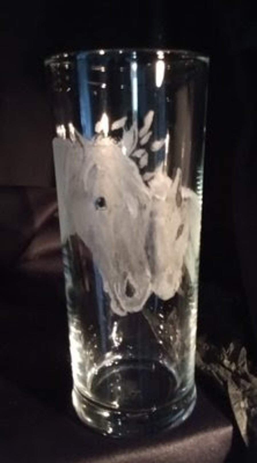 Horses on a tall glass tumbler