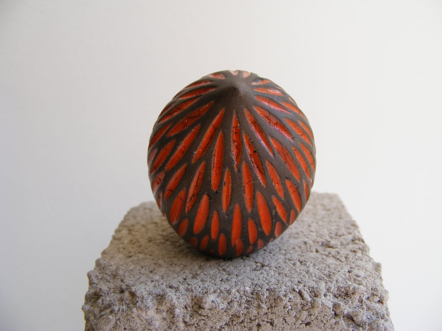 Carved baby bird, orange.