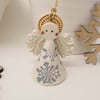Teeny little ceramic angel Christmas decoration
