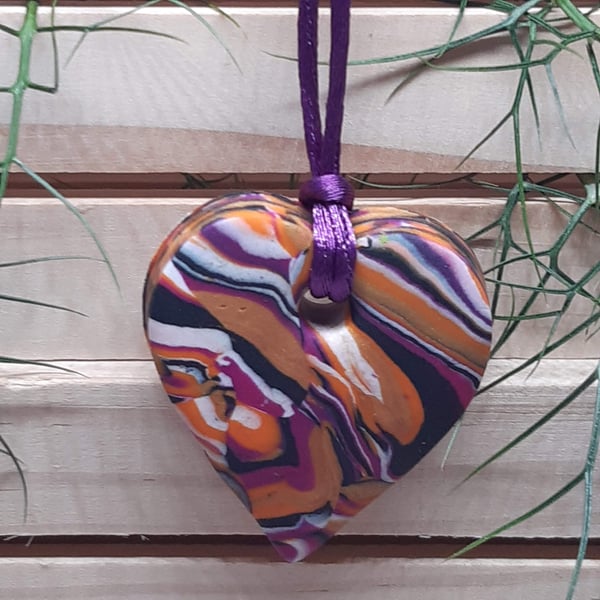 Orange, hot pink, gold and black heart polymer clay pendant