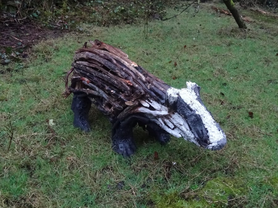 Badger sculpture made from driftwood - support rewilding