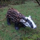 Badger sculpture made from driftwood - support rewilding