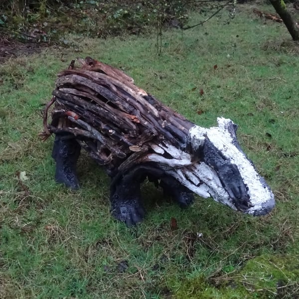 Badger sculpture made from driftwood - support rewilding