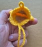 Flower shaped bag charm with small storage space. - Image 3