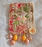 Peach and yellow floral brooch.
