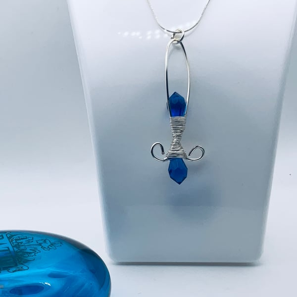 Bargain blue glass crystal and wire pendant