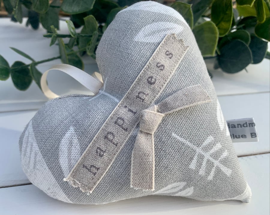 Fabric lavender heart hand stamped with the word ‘happiness’ in grey