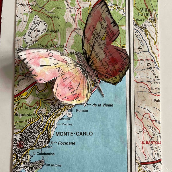 Monte-Carlo Butterfly, red yellow butterfly image on a map