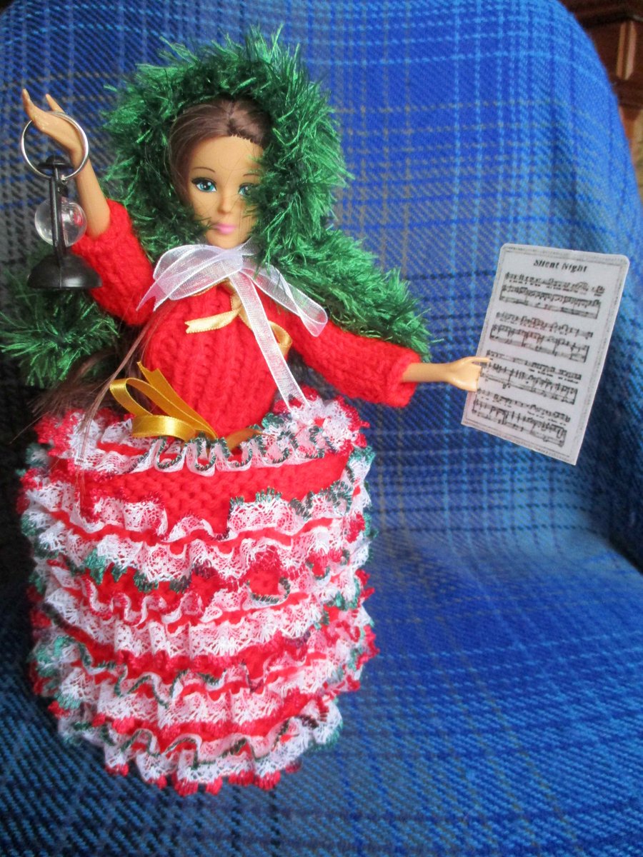 Hand Knitted Carol singer Doll Spare Toilet Roll Cover