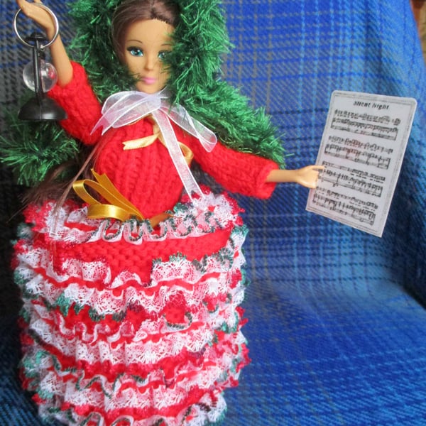 Hand Knitted Carol singer Doll Spare Toilet Roll Cover