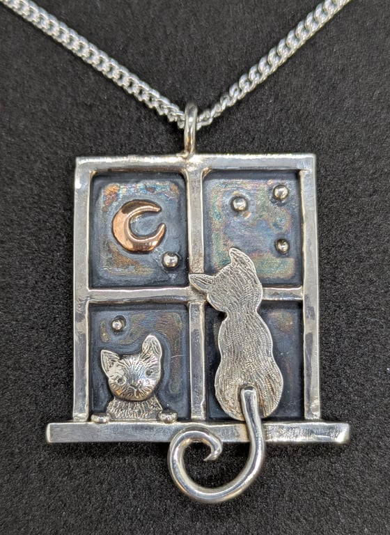 Handcrafted sterling silver window pendant with cats and red gold moon