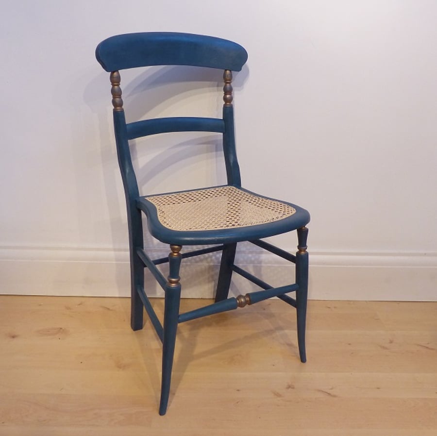 Antique chair in teal blue chalk paint, re-caned seat