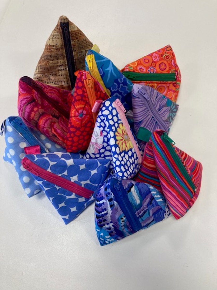 Pyramid purses for phone chargers