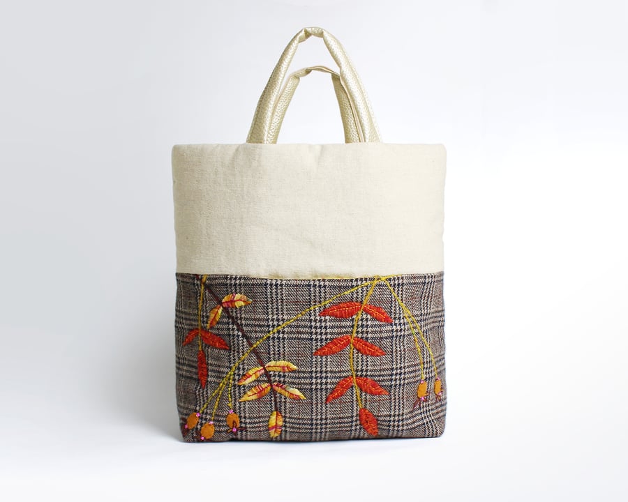 Wool check and oatmeal bag with front pocket and hand stitched rose hip