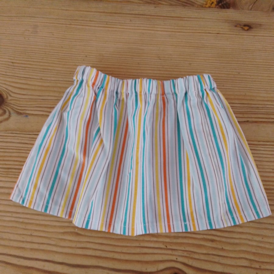 Baby skirt in a bright stripe pattern age 3-6 months.