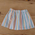 Baby skirt in a bright stripe pattern age 3-6 months.