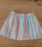 Baby skirt in a bright stripe pattern age 3-6 months.