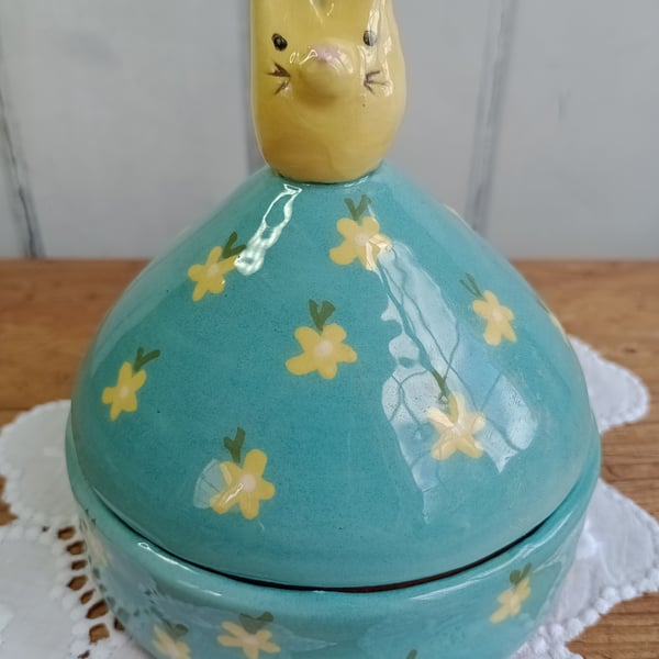 Turquoise lidded pot with bunny knob and flower design