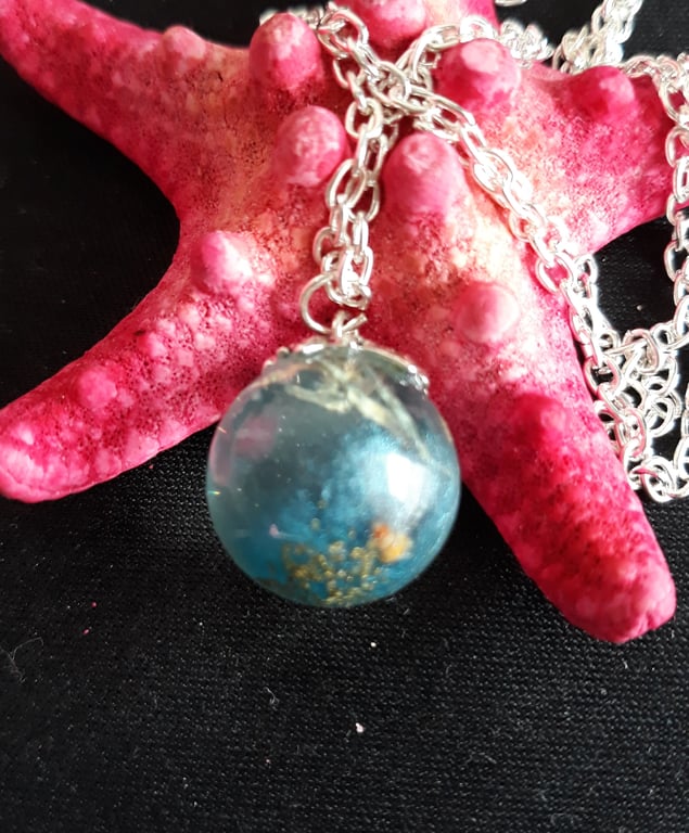 R2.  Seaside theme resin globe necklace
