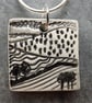 Handmade Ceramic Landscape pendant in black, white and grey - Image 1