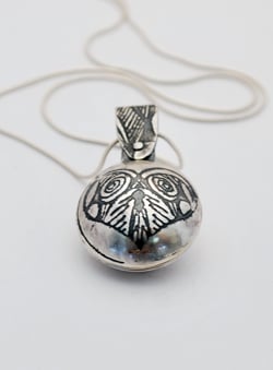 Sterling silver heart locket, swivel design