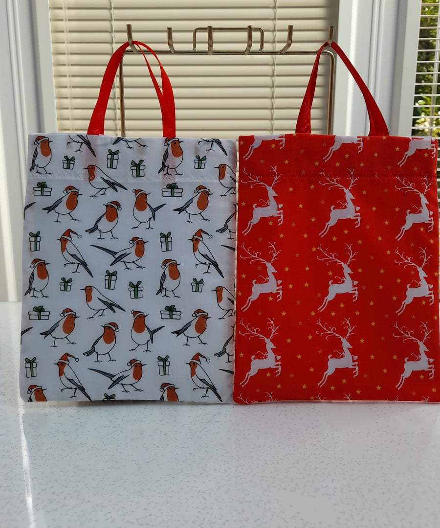 Set of two Christmas party gift bags handmade in a poly cotton fabric. 
