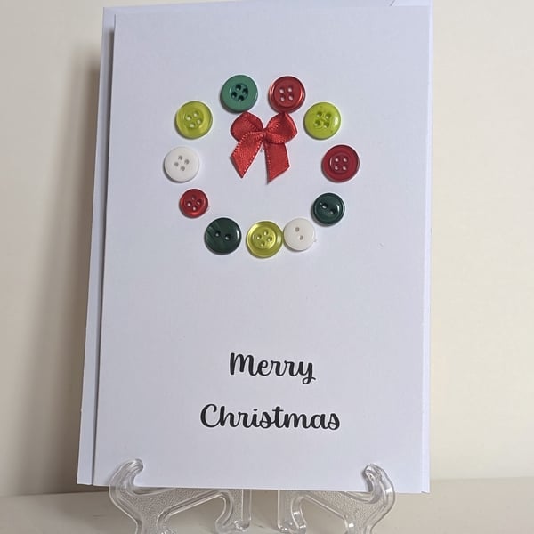 Merry Christmas card with a button Christmas wreath