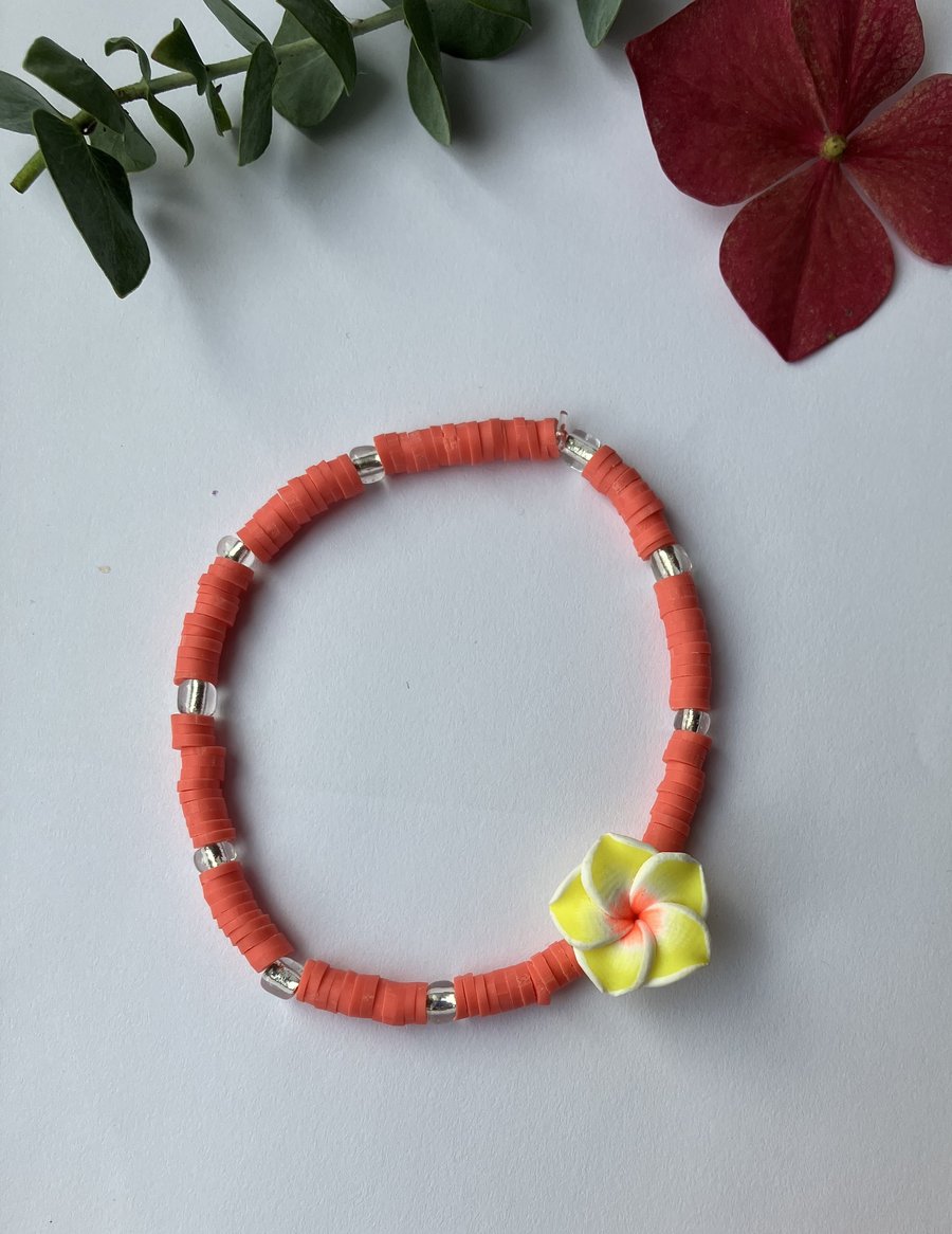 Coral clay-bead bracelet with YELLOW Frangipani charm