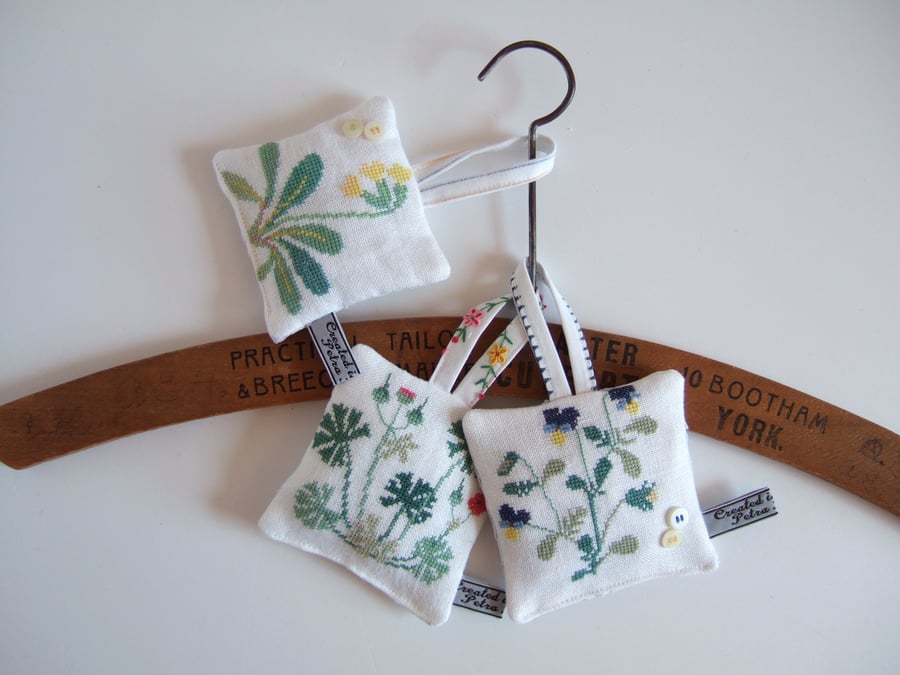 A Set of 3 lavender bags with vintage botanical embroidery.