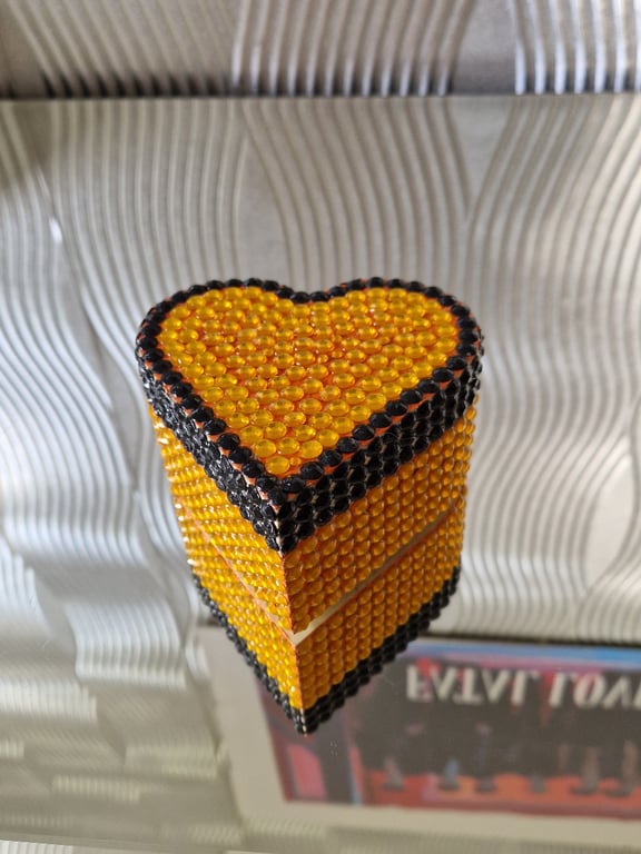 Heart shaped sequinned wooden box.