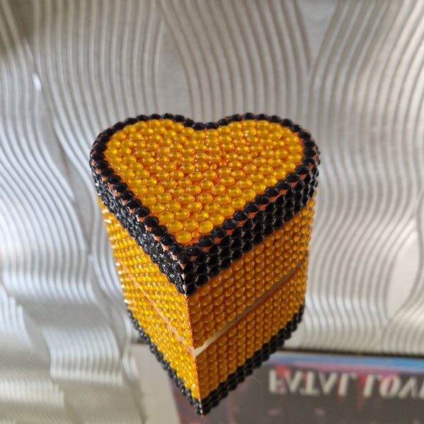 Heart shaped sequinned wooden box.
