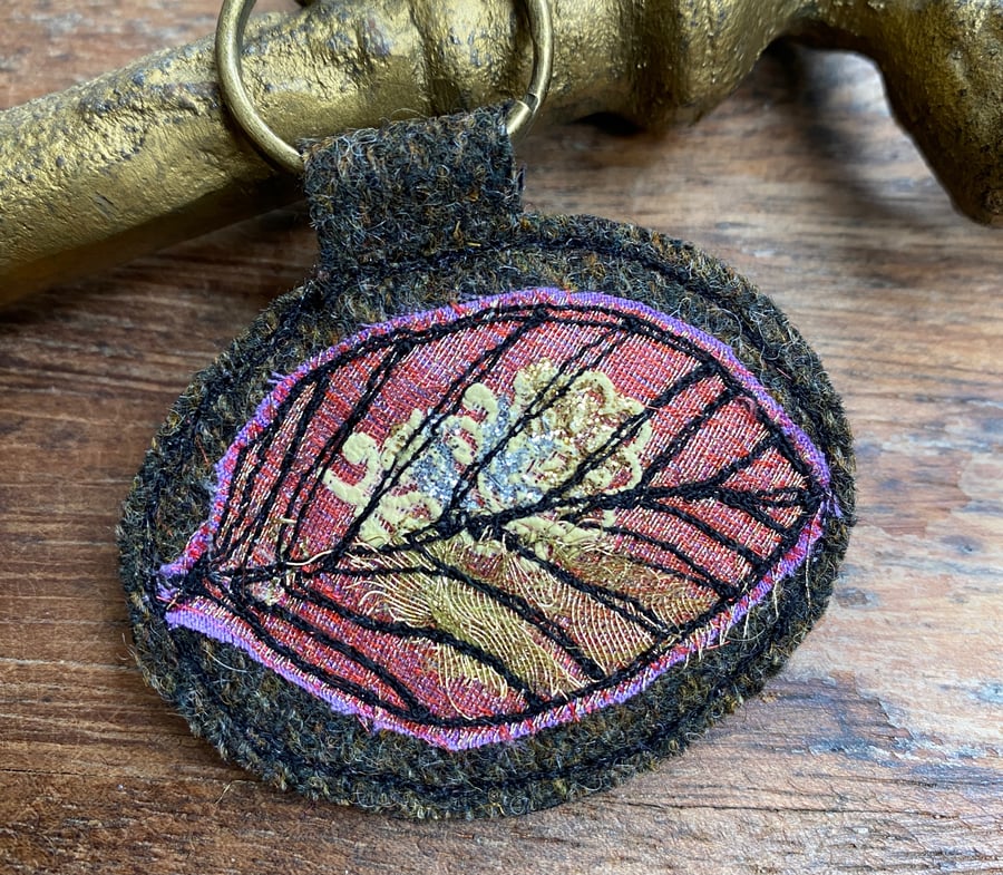 Up-cycled leaf plaid key ring or bag charm. 