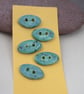 5 Small Oval Eggshell Blue Ceramic Buttons - Image 1