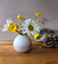 Small pink and white pottery bud vase