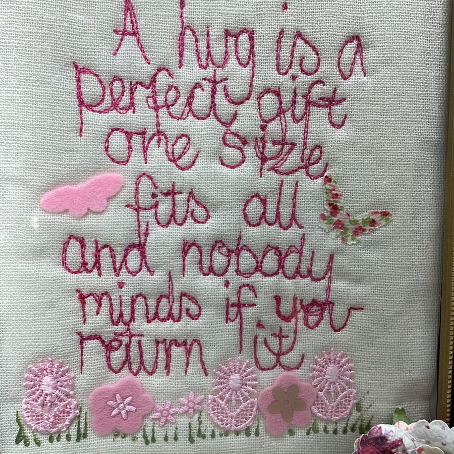 A hug is a perfect gift and nobody minds if you return it. Embroidered picture.