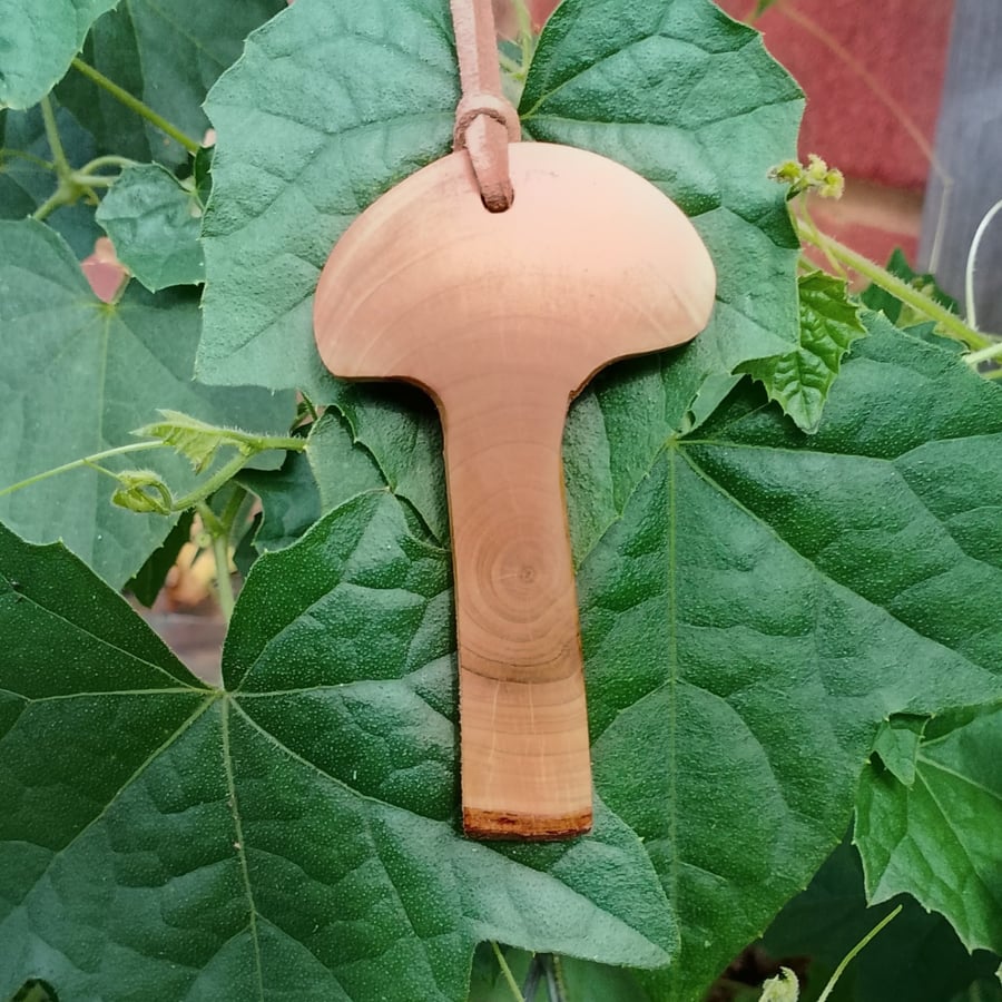 Linden (Lime) Wood Pendant in a mushroom form.