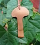Linden (Lime) Wood Pendant in a mushroom form.