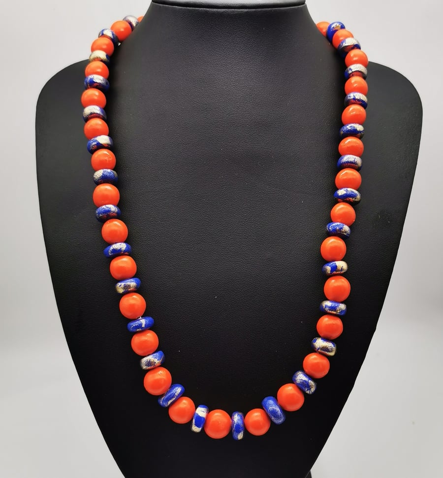 Eye catching orange and blue handmade beaded necklace with gold shimmer