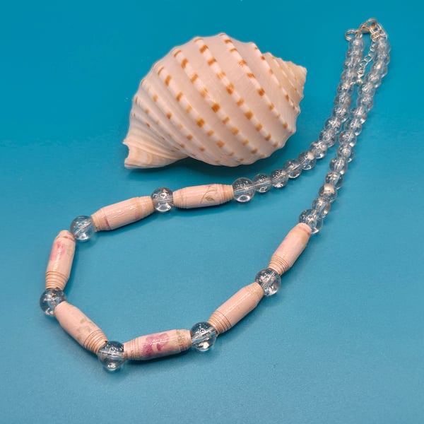 Delicate necklace made with pale pink paper beads and transparent beads