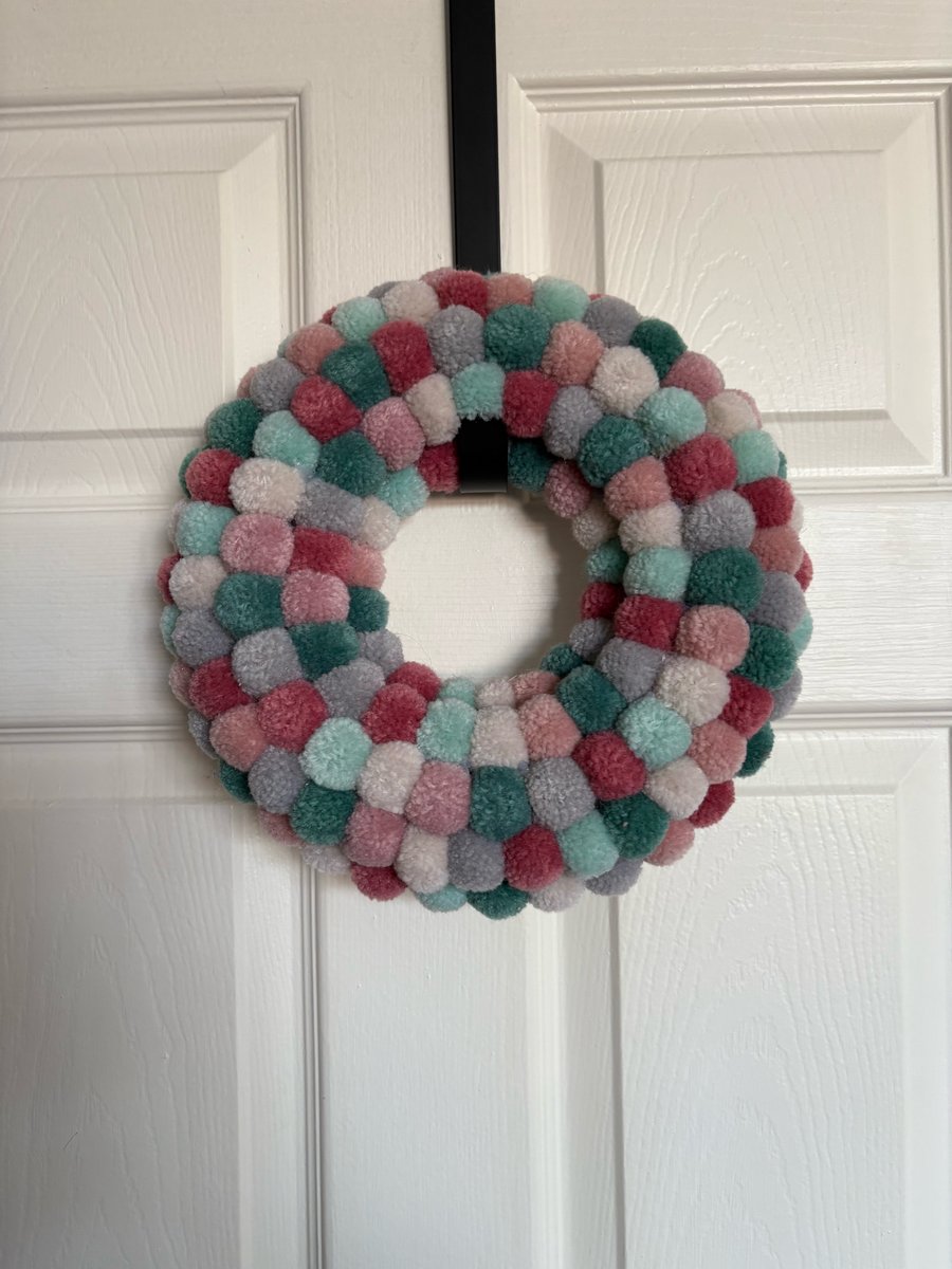 Delicate shades wool Pom Pom wreath. 