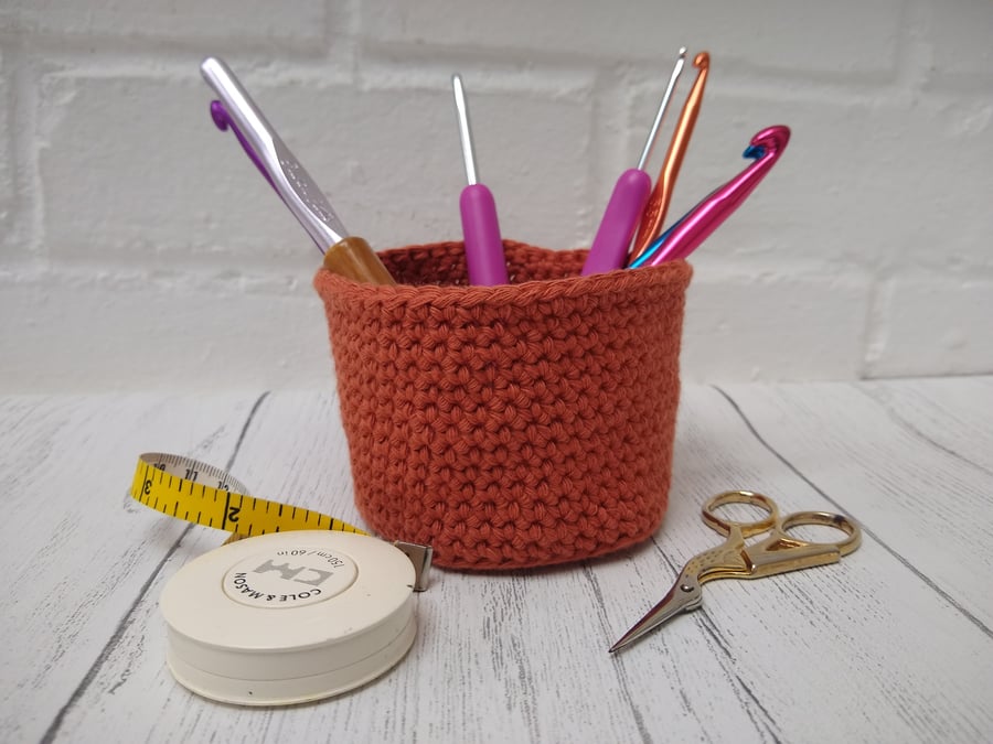 Orange crocheted basket, desk tidy, pot cover