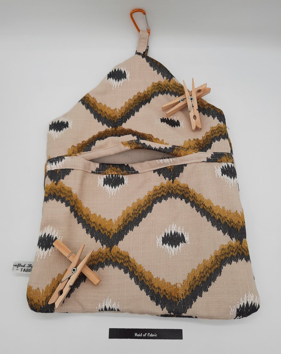 Cream, black and gold clip on peg bag.  Free uk delivery 