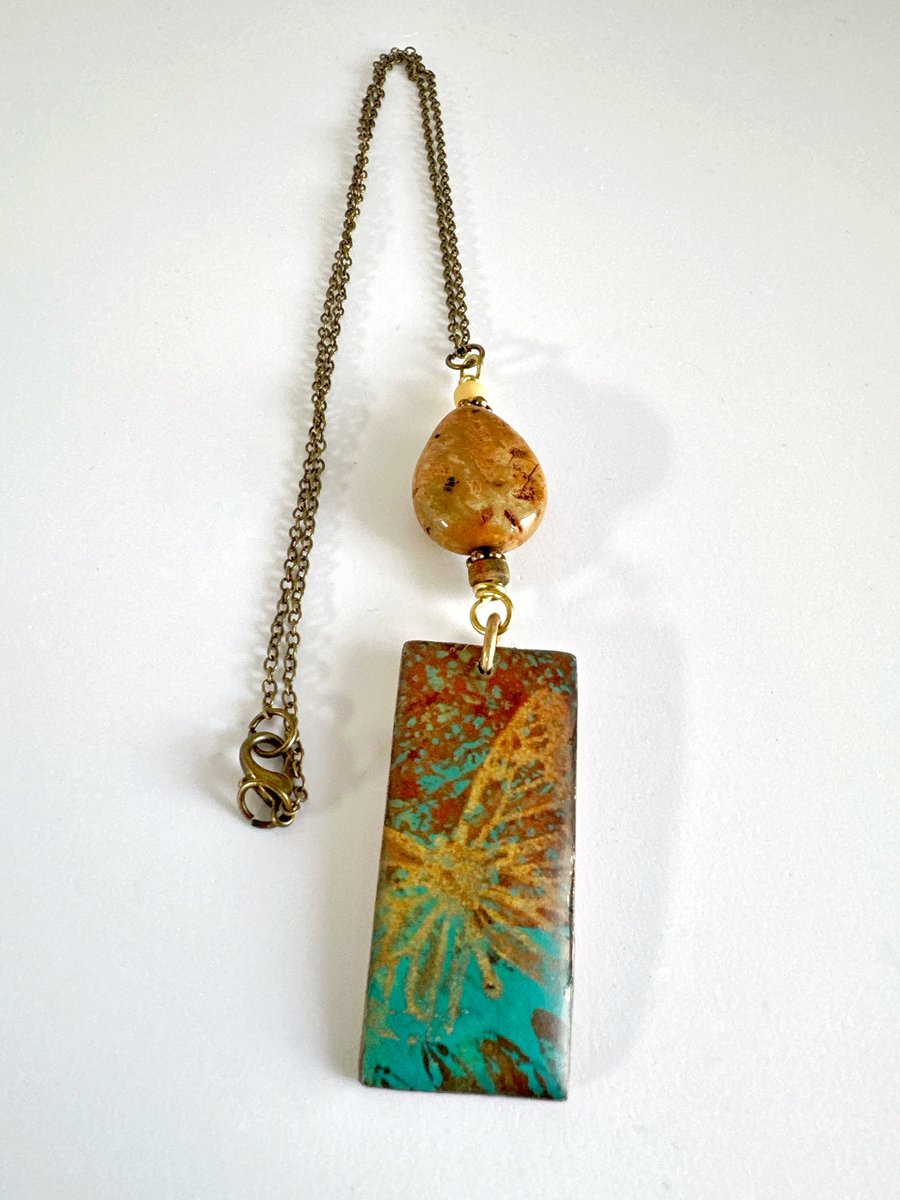 Handprinted butterfly pendant combined with jasper and agate stones.