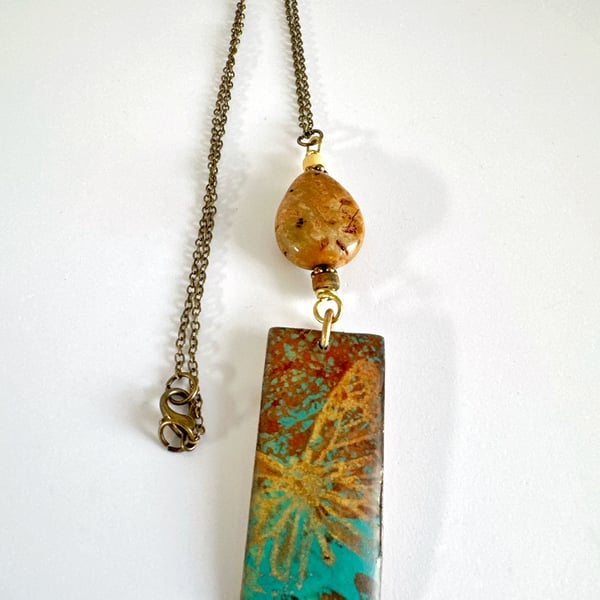 Handprinted butterfly pendant combined with jasper and agate stones.