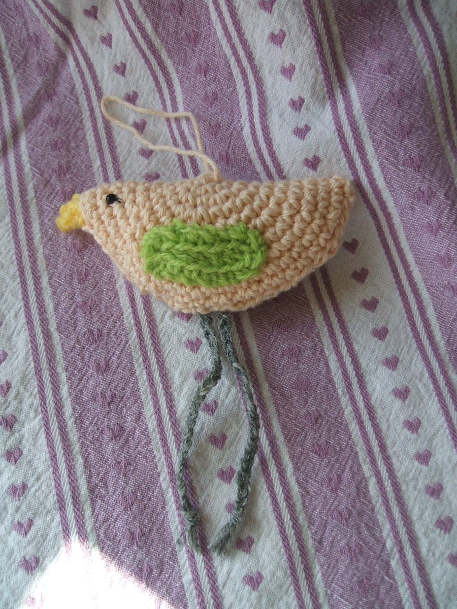 hand crocheted hanging bird - cream with green wings