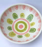Ceramic patterned dish with pink and green design