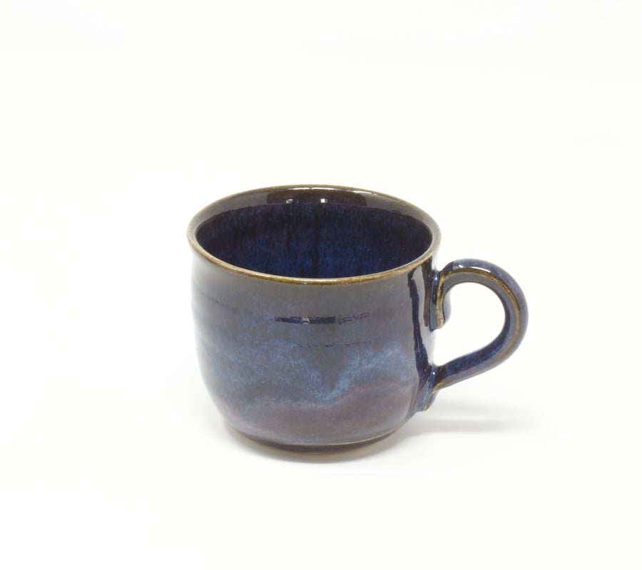 Small purpley blue wavy coffee cup