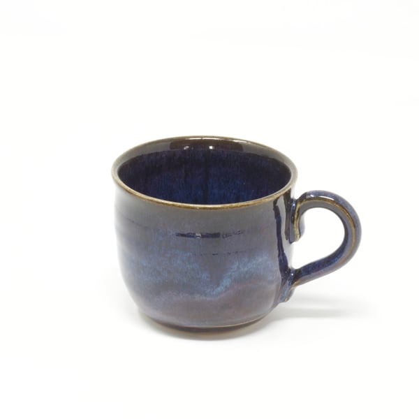 Small purpley blue wavy coffee cup