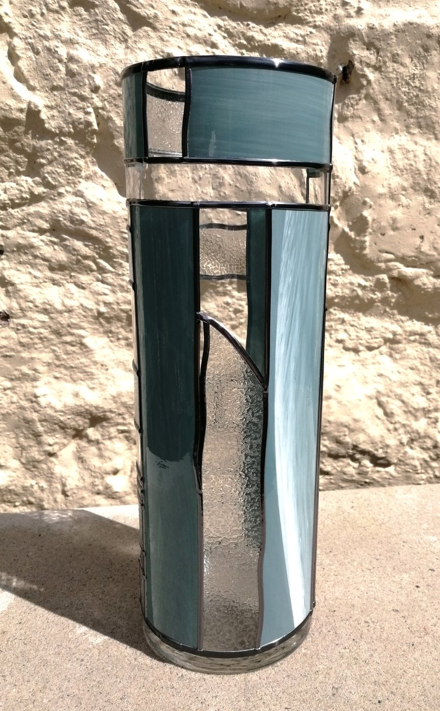 Glacial Blues is a 30cm Tall Art Deco Stained Glass Flower Vase. Handleaded Desi