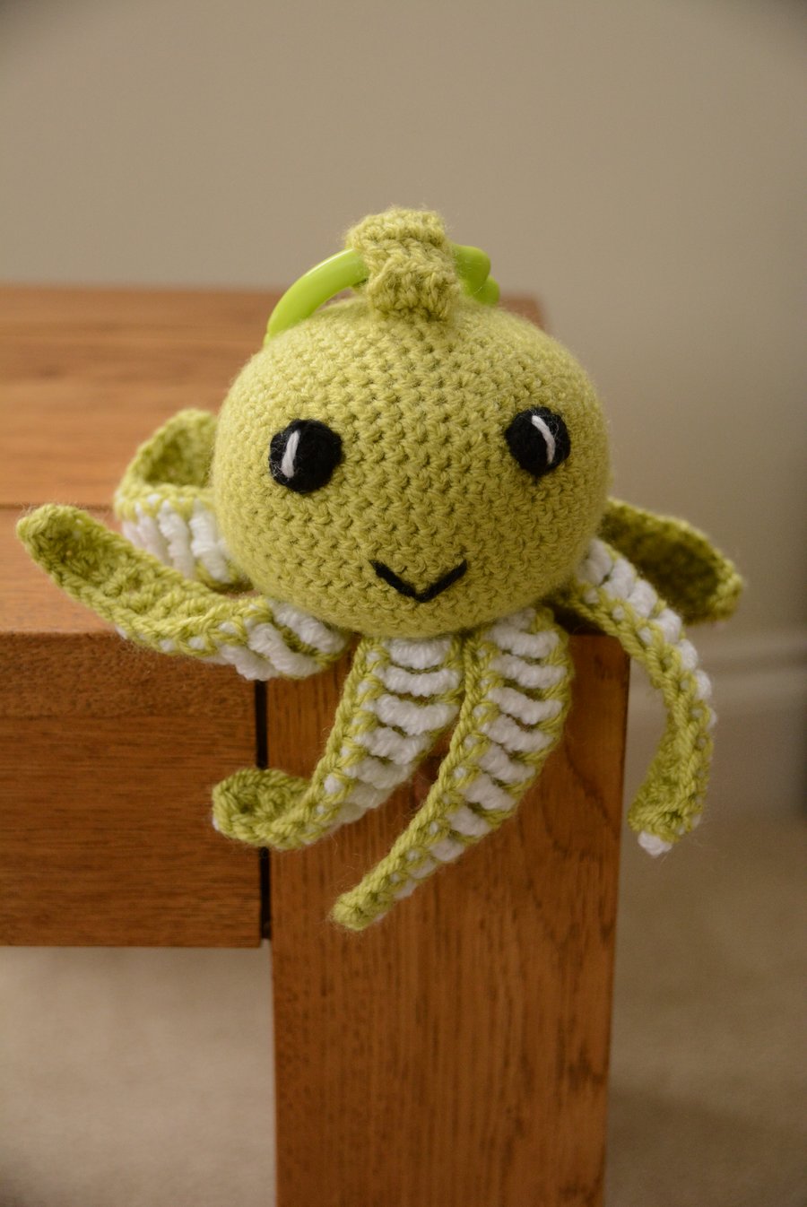 Octopus Soft Toy with teething ring and internal rattle - pistachio 